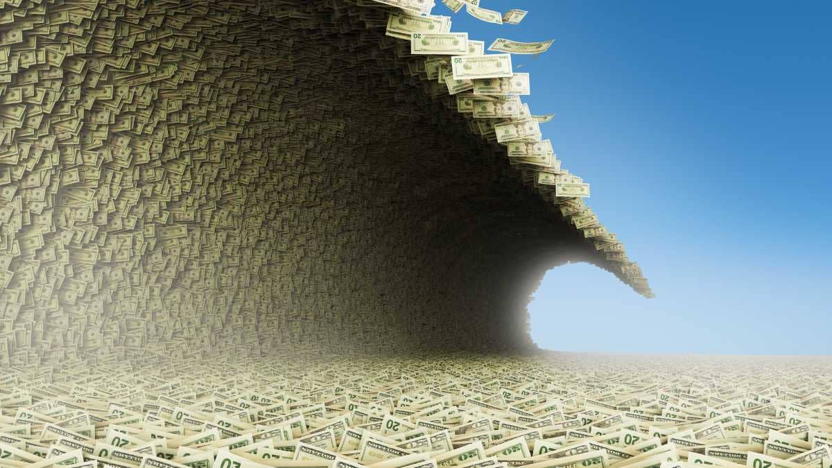 Wave of dollar bills creating a tunnel on a clear day