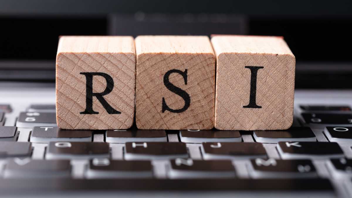 Wooden blocks spelling RSI on a laptop keyboard