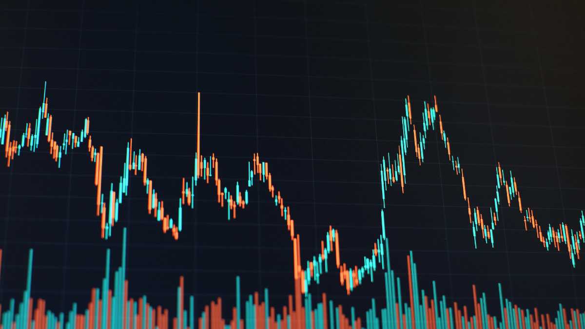 Candlestick chart with volume bars indicating stock market activity