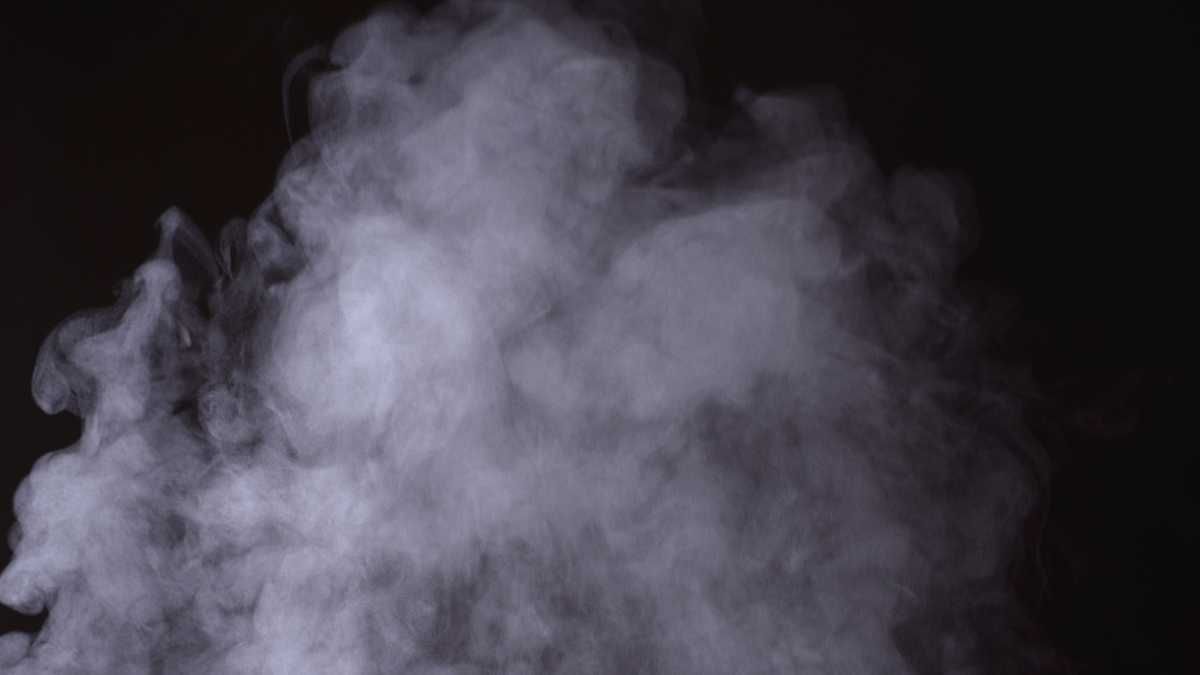 Wispy smoke on a dark background.