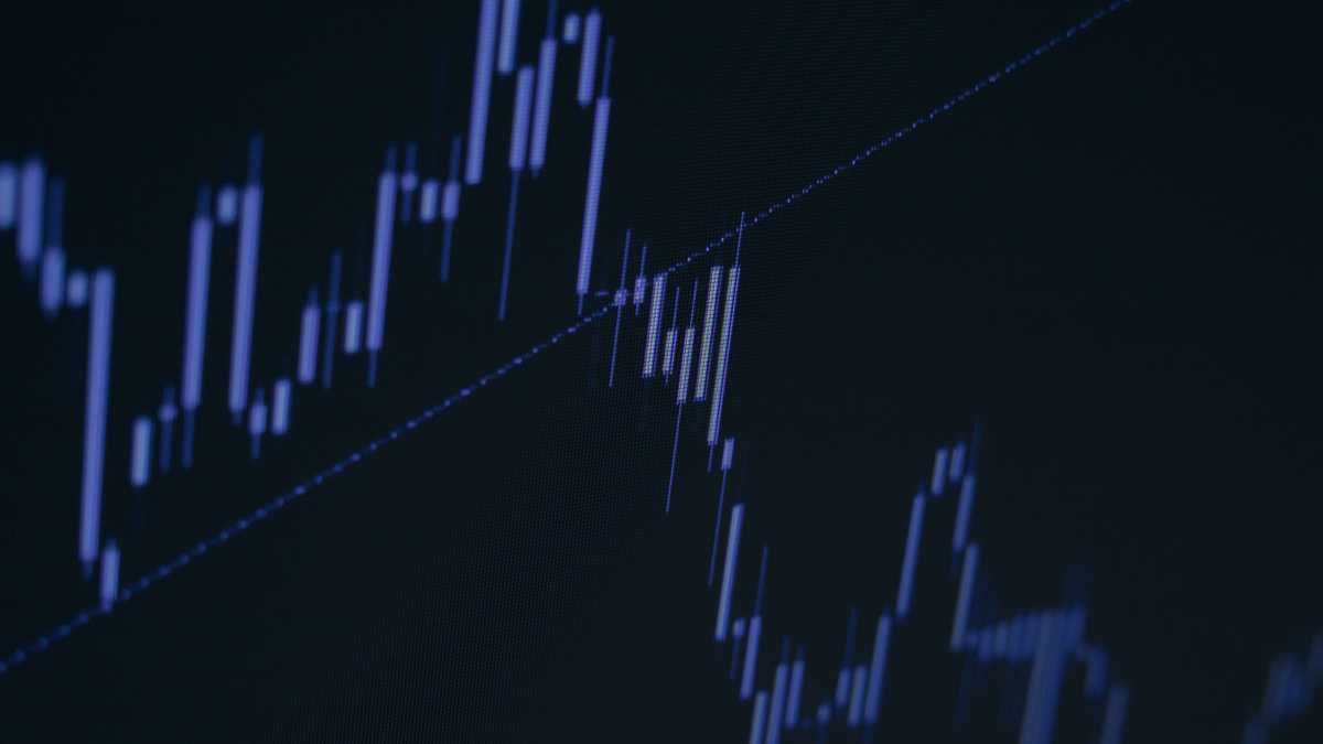 Candlestick chart on a dark screen representing financial data