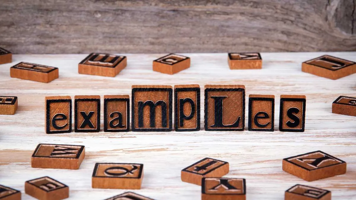 Wooden blocks spelling examples on a table