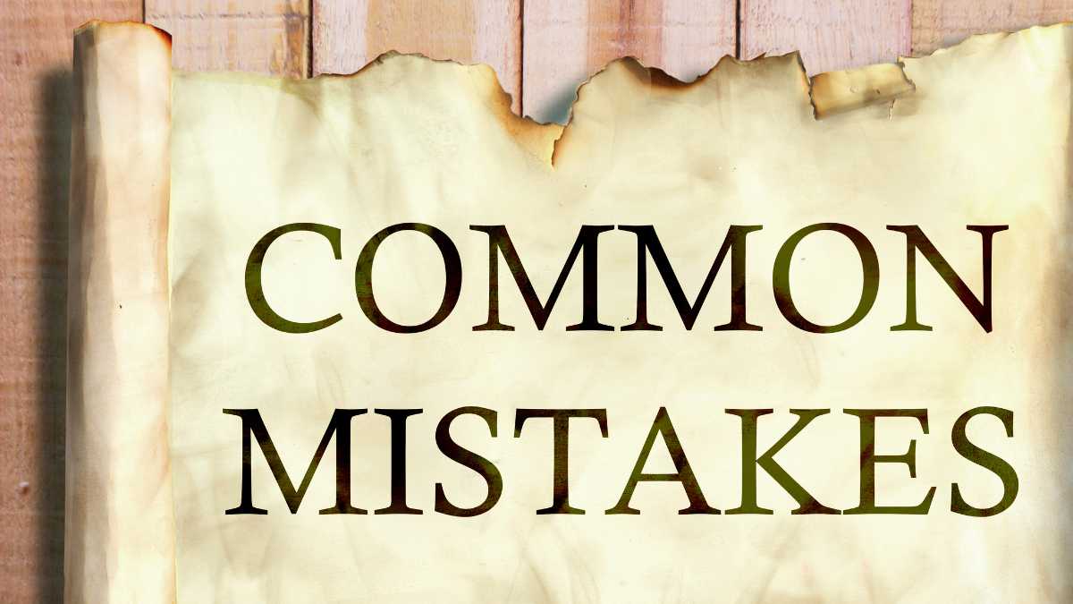 Text COMMON MISTAKES on a burnt paper background