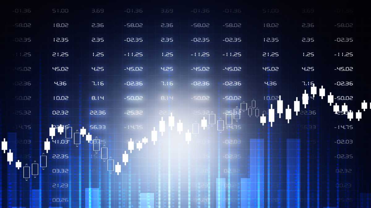 A digital stock market chart with blue candlesticks on a dark background