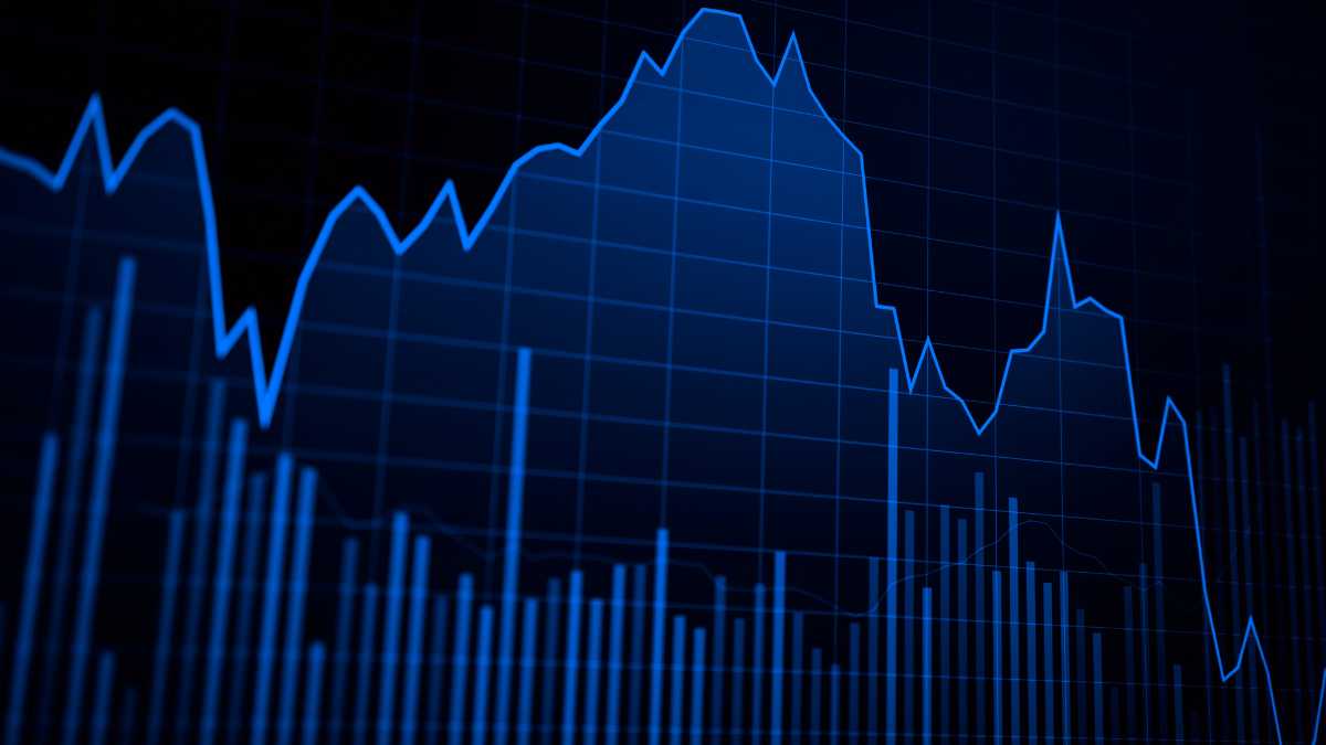 Dark blue stock market graph with fluctuating lines and bar chart.