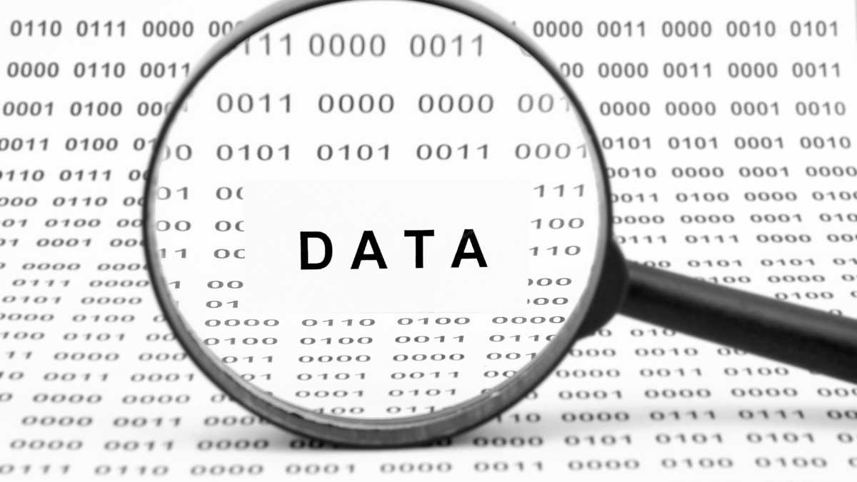 A lens focusing on the word DATA on a data sheet