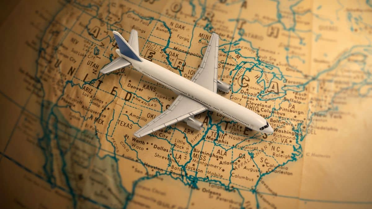 a model aeroplane resting on top of a vintage style map