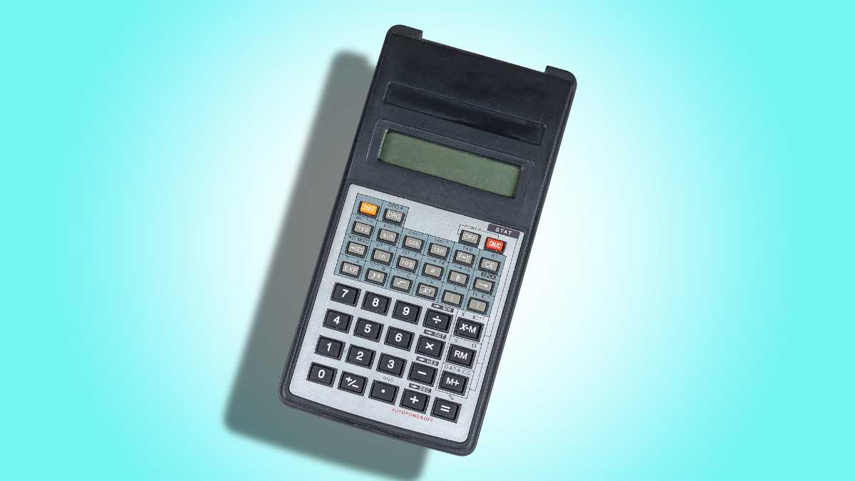 A vintage calculator with a black body on a blue background