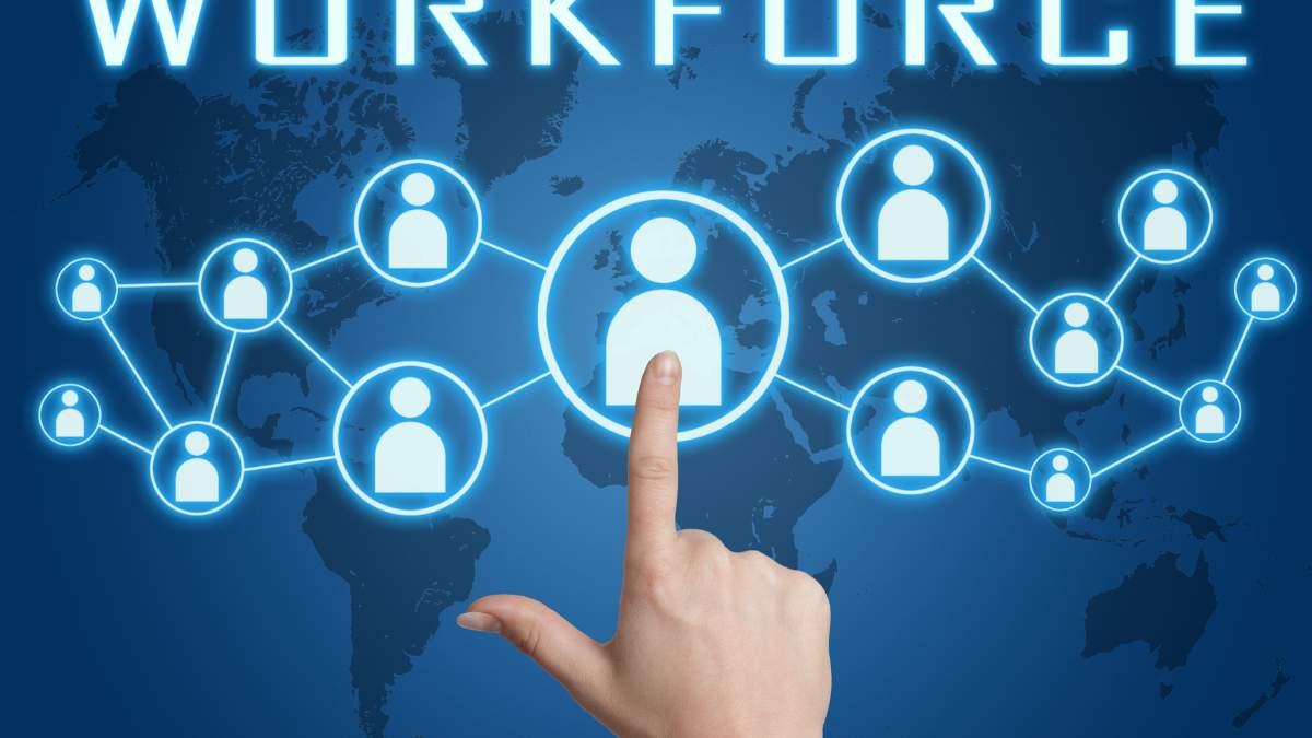 a hand pointing to an icon of a person within a network of other icons against a digital world map background with the word WORKFORCE above