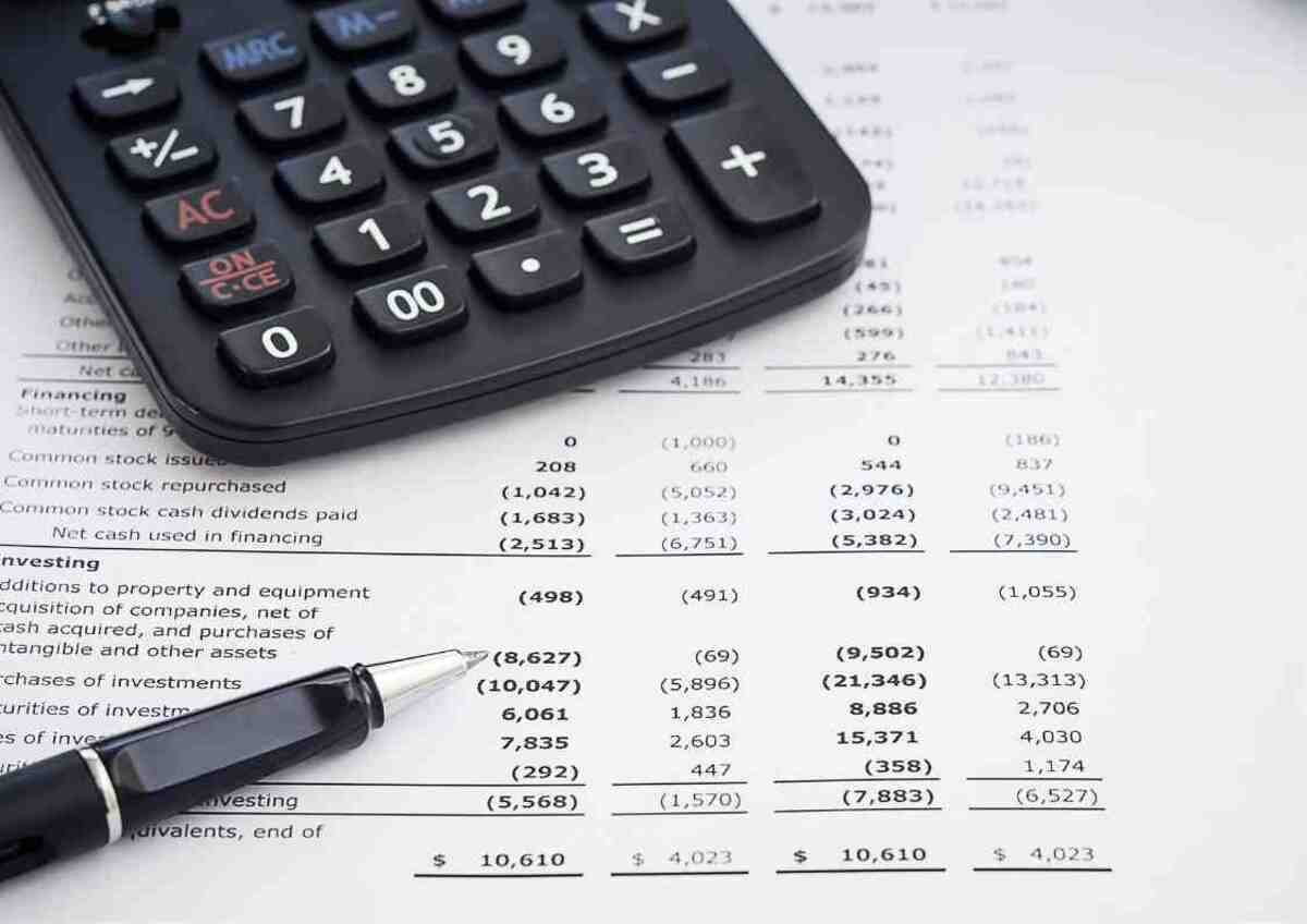 Calculator and pen on financial report