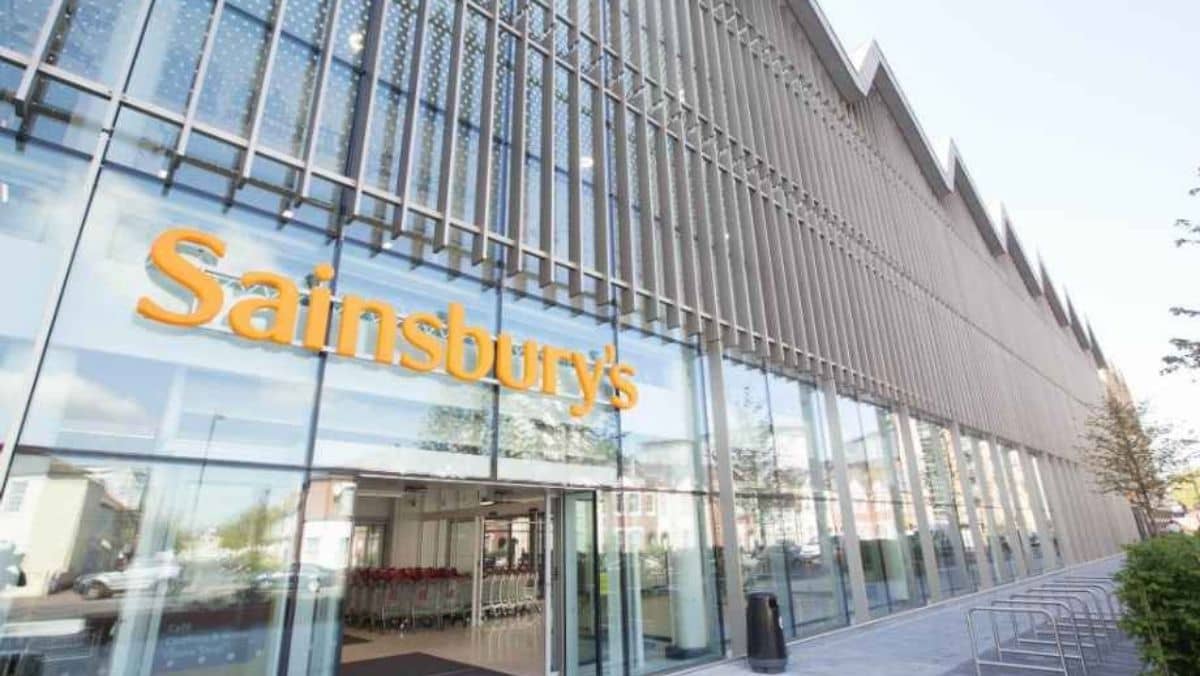 A building displaying a Sainsbury's sign positioned above its entrance