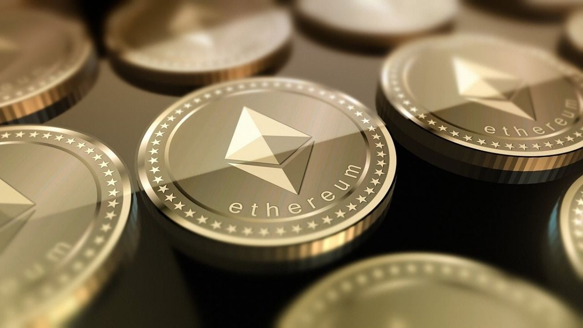 A flat arrangement of Ethereum coins on a smooth surface