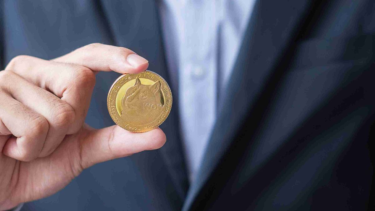 A person proudly displaying a gold coin for everyone to see