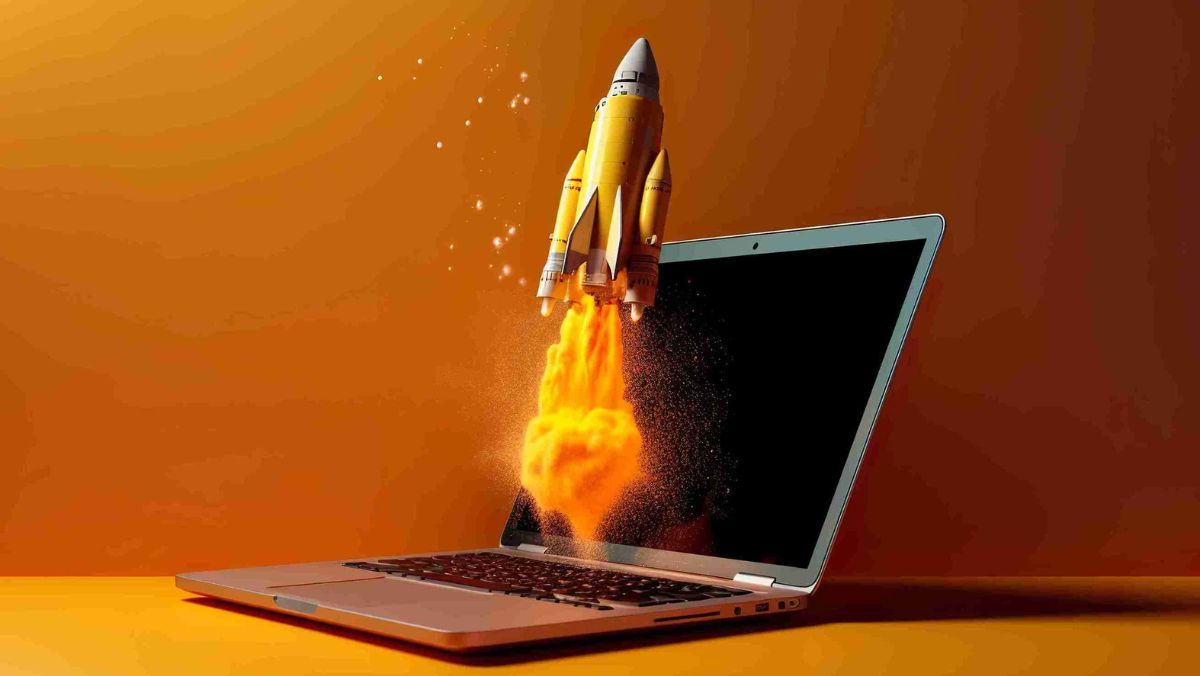 A rocket taking off from an open laptop