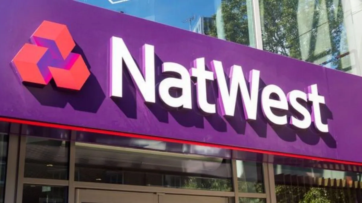 A signboard displaying “NatWest” and its logo