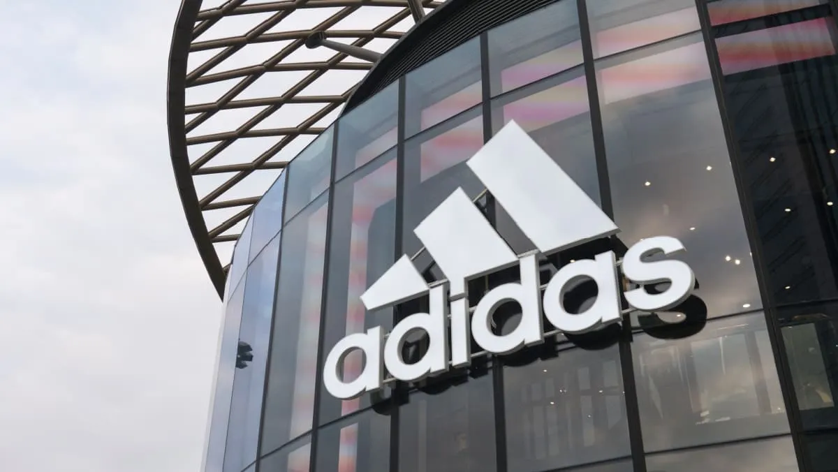 Adidas stock mostly flat as company reports first loss in 30 years