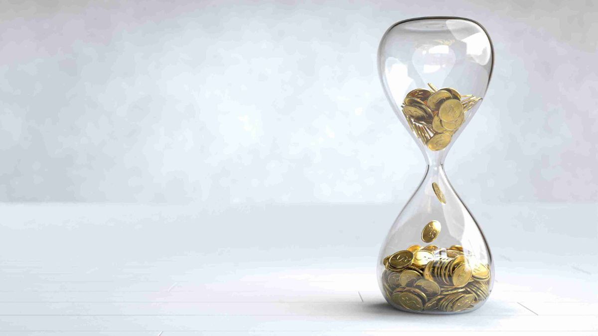 An hourglass releasing a steady stream of gold coins