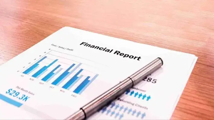 financial report documents with pen on the table