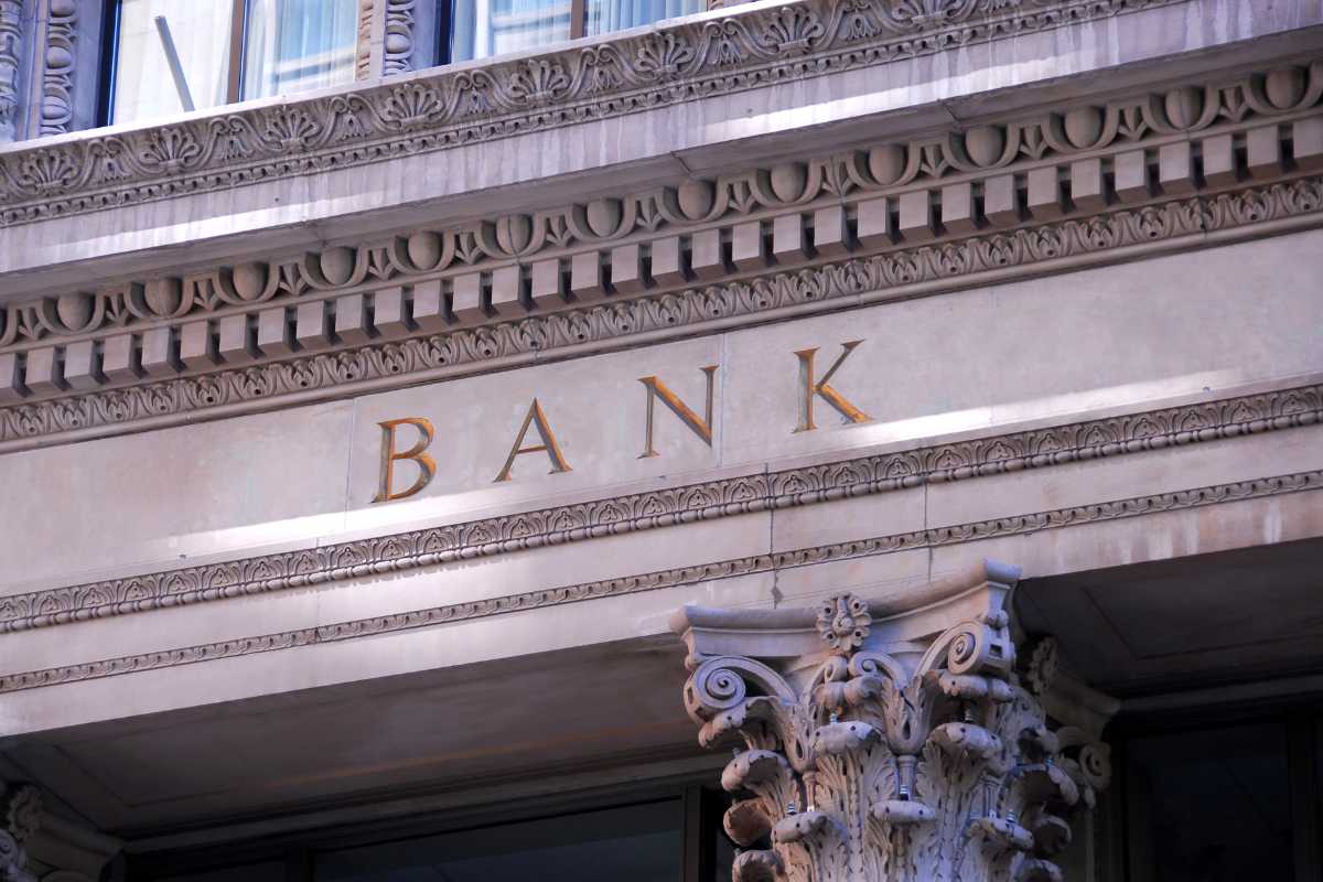 Classic bank building facade with the word BANK engraved