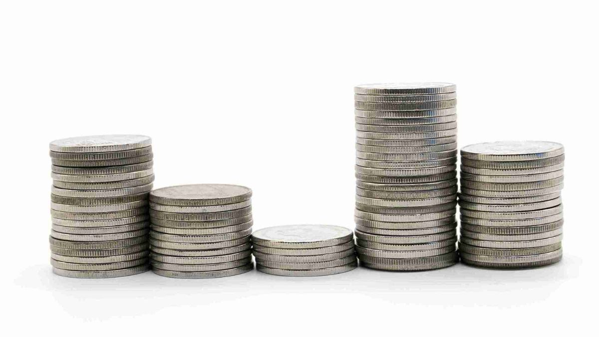 Coins in shades of silver stacked at various levels