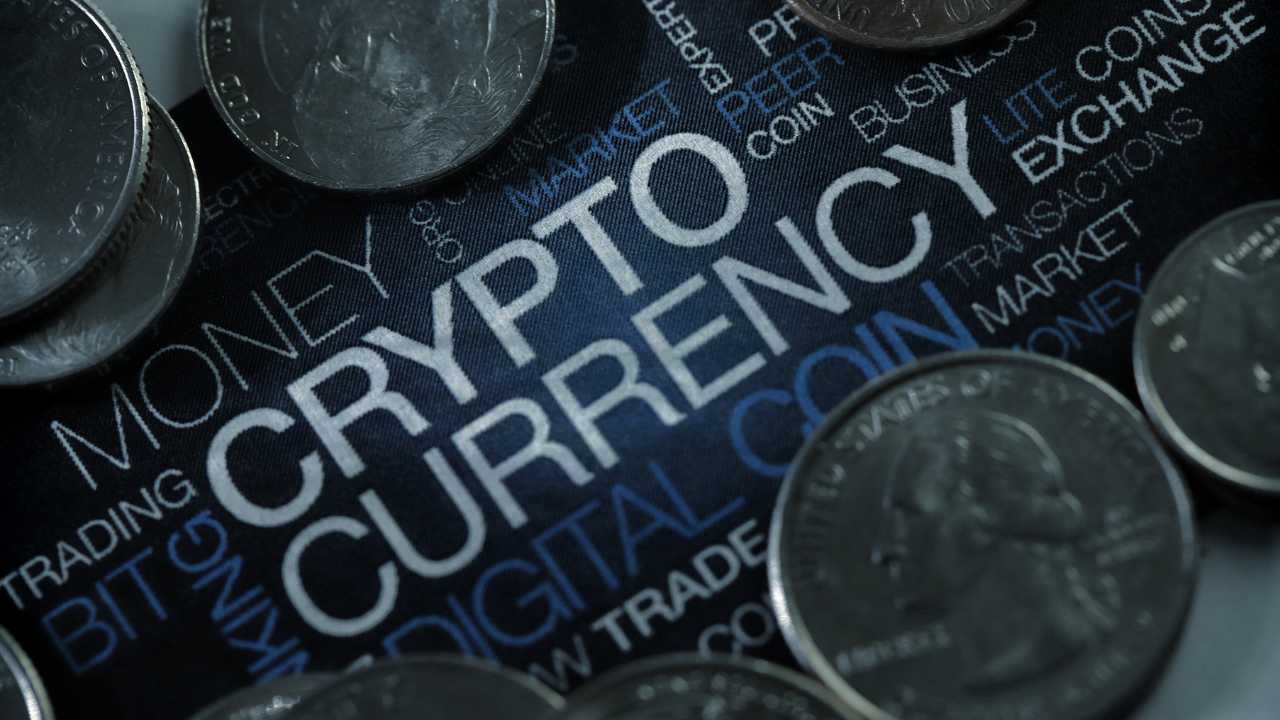 Coins on a surface with CRYPTOCURRENCY text