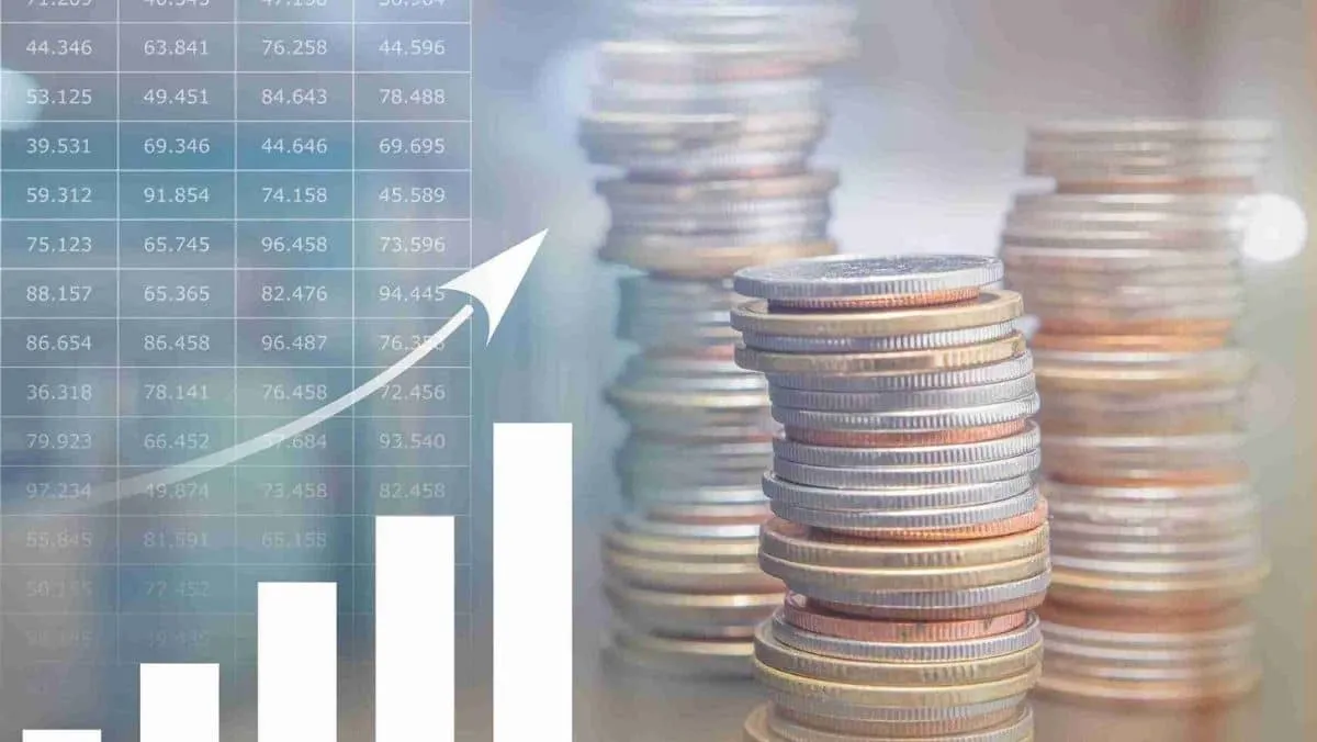 Coins stacked next to financial information on the left