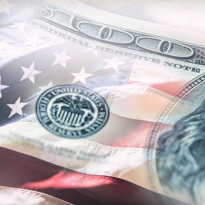 Dollar bill imposed over US flag