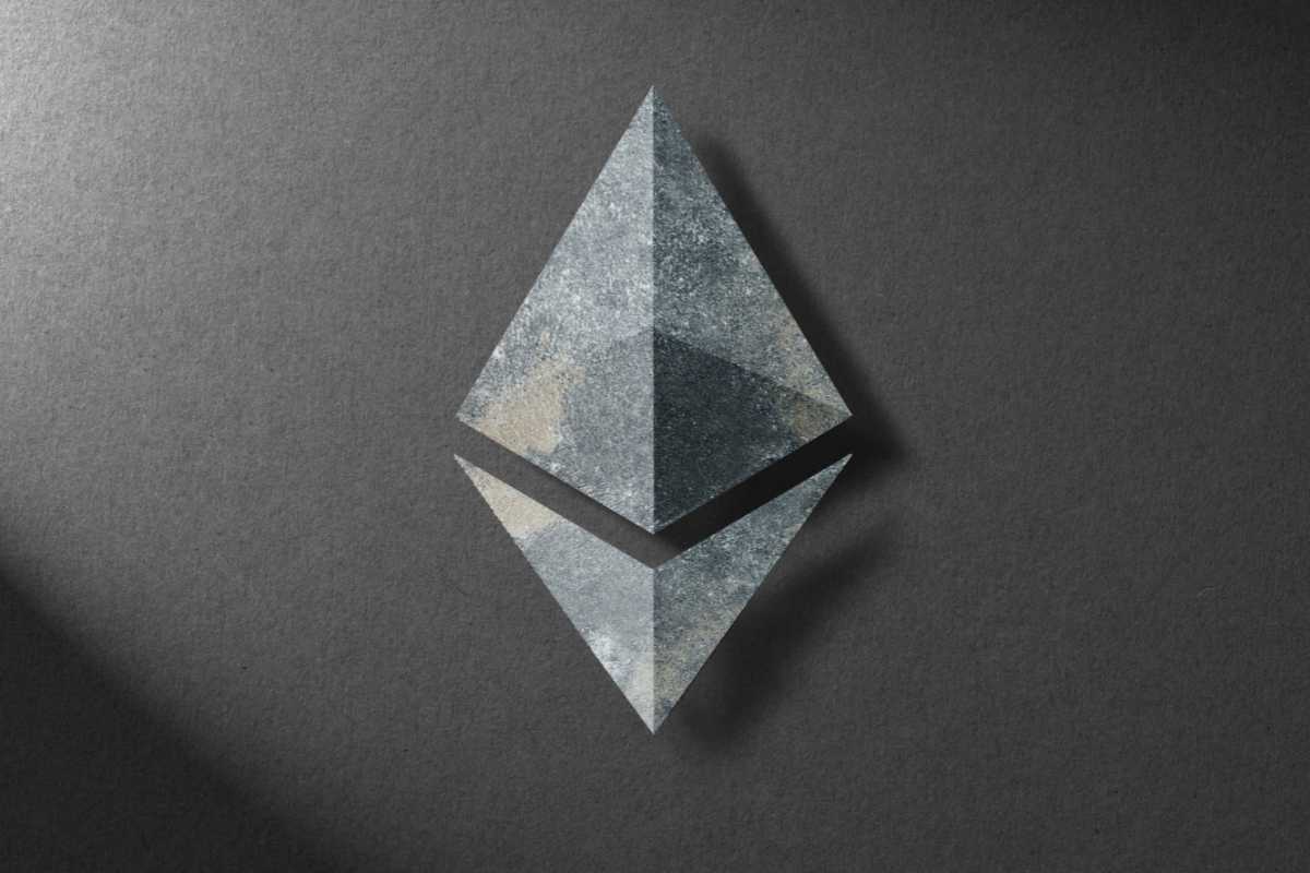 Ethereum logo on a textured dark background with shadow effect