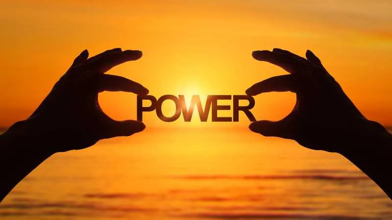 Hands framing the word POWER against a sunrise backdrop