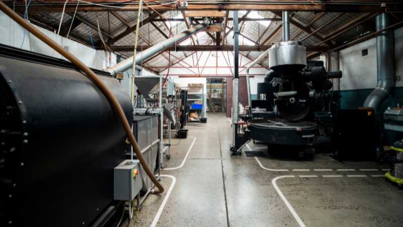 Industrial coffee roasting facility with large machinery