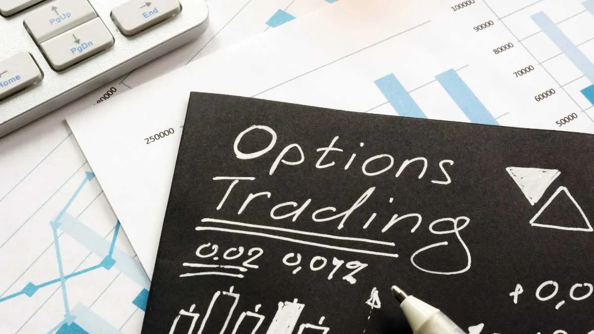 Note reading Options Trading with charts and calculator in the background