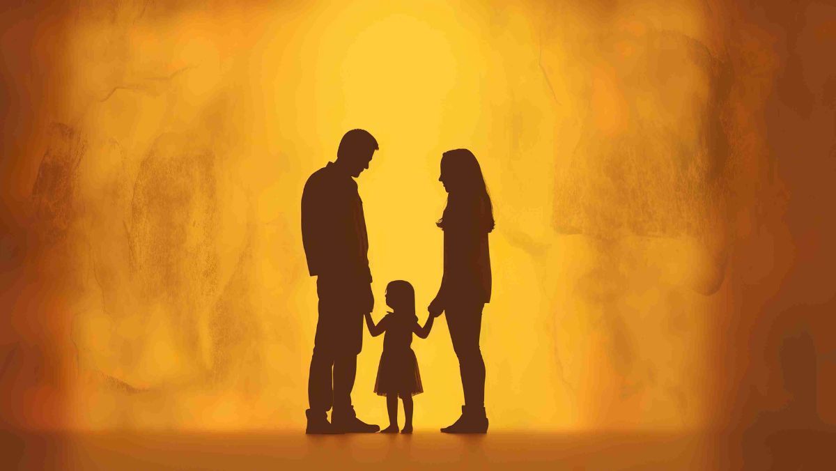 Shadow of a family showing a mother and father holding their kid