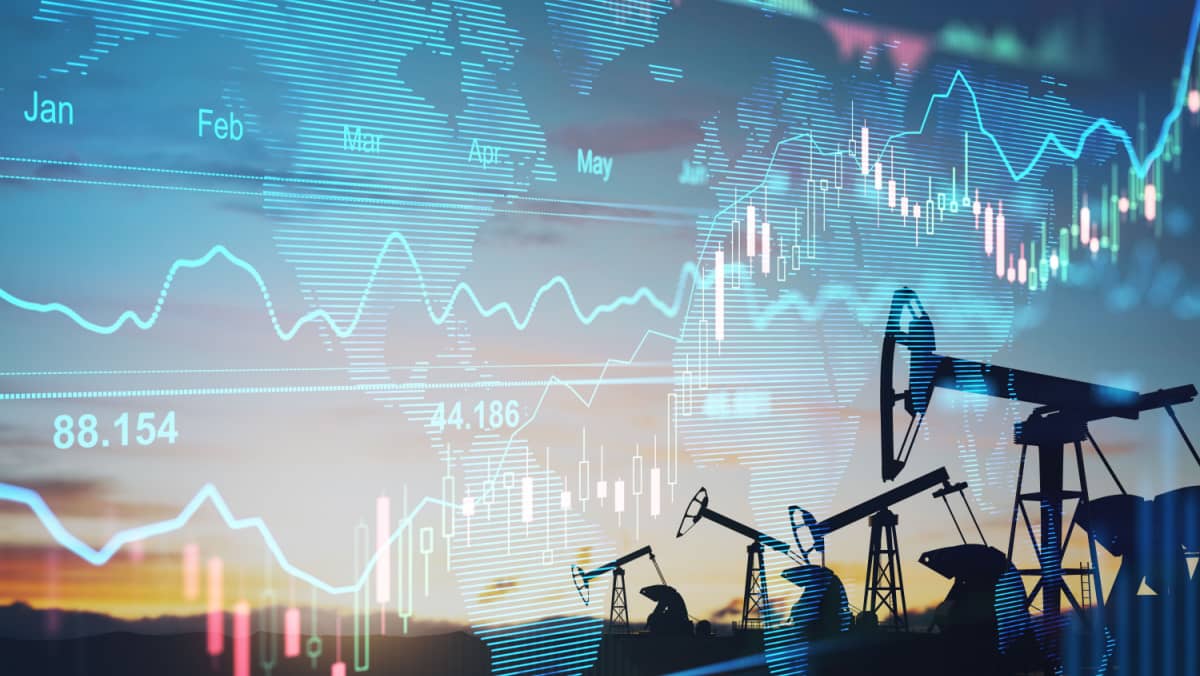 Rise in gasoline prices concept with double exposure of digital screen with financial chart graphs and oil pumps on a field