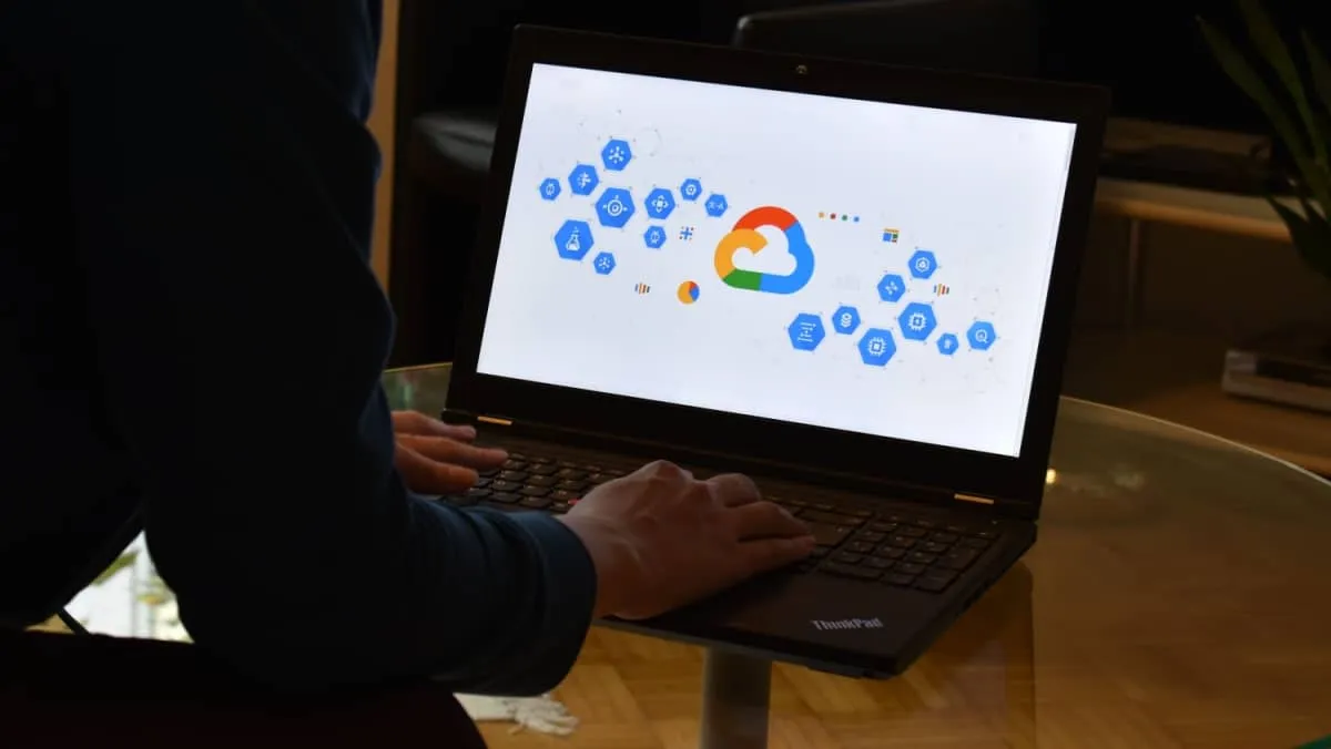 A programmer working from home focusing on a computer screen displaying the Google Cloud products diagram