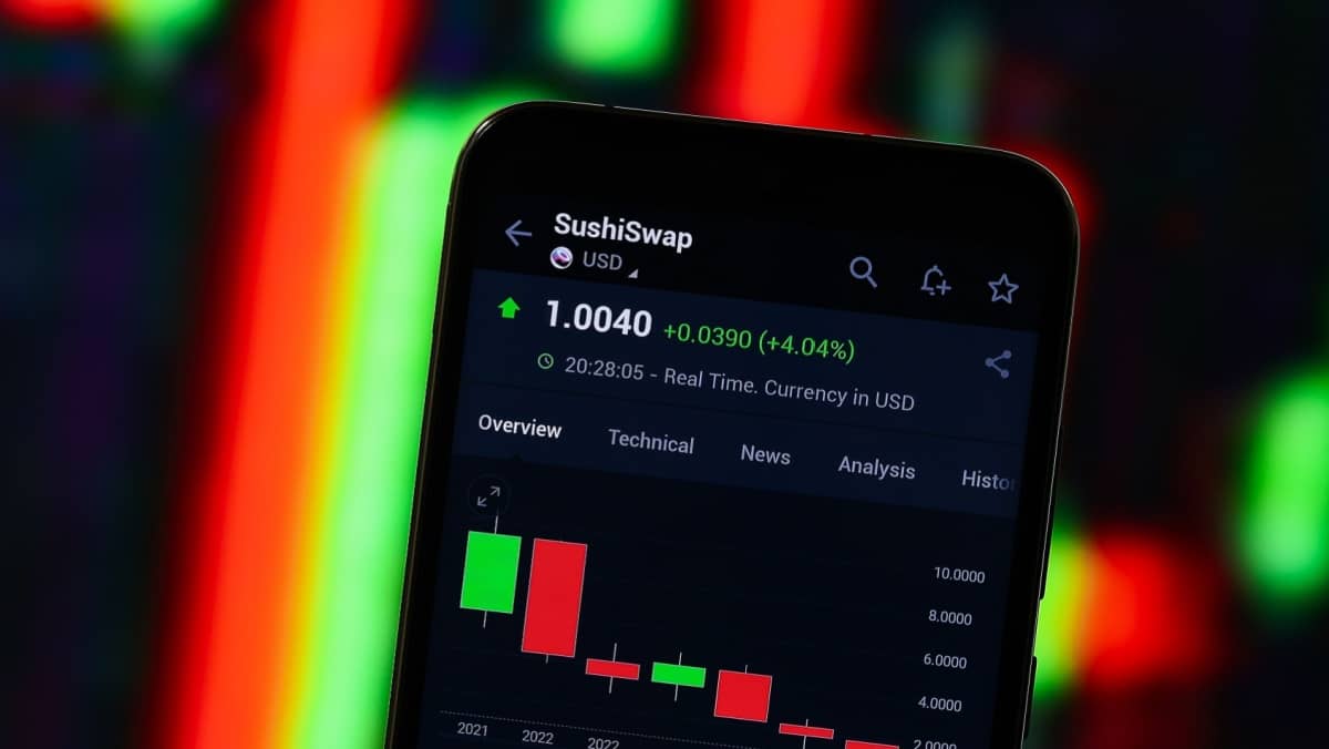 Close-up view of Sushiswap on a trading platform displayed on a smartphone screen