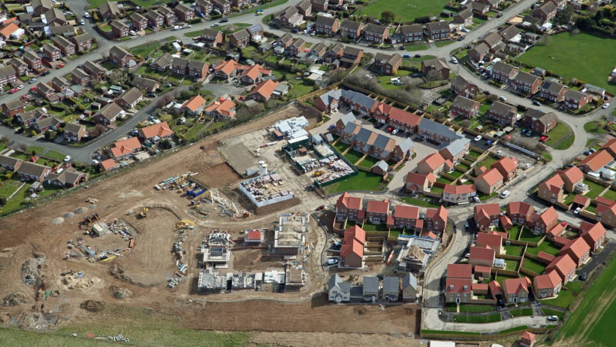 Aerial view of housing development under construction.