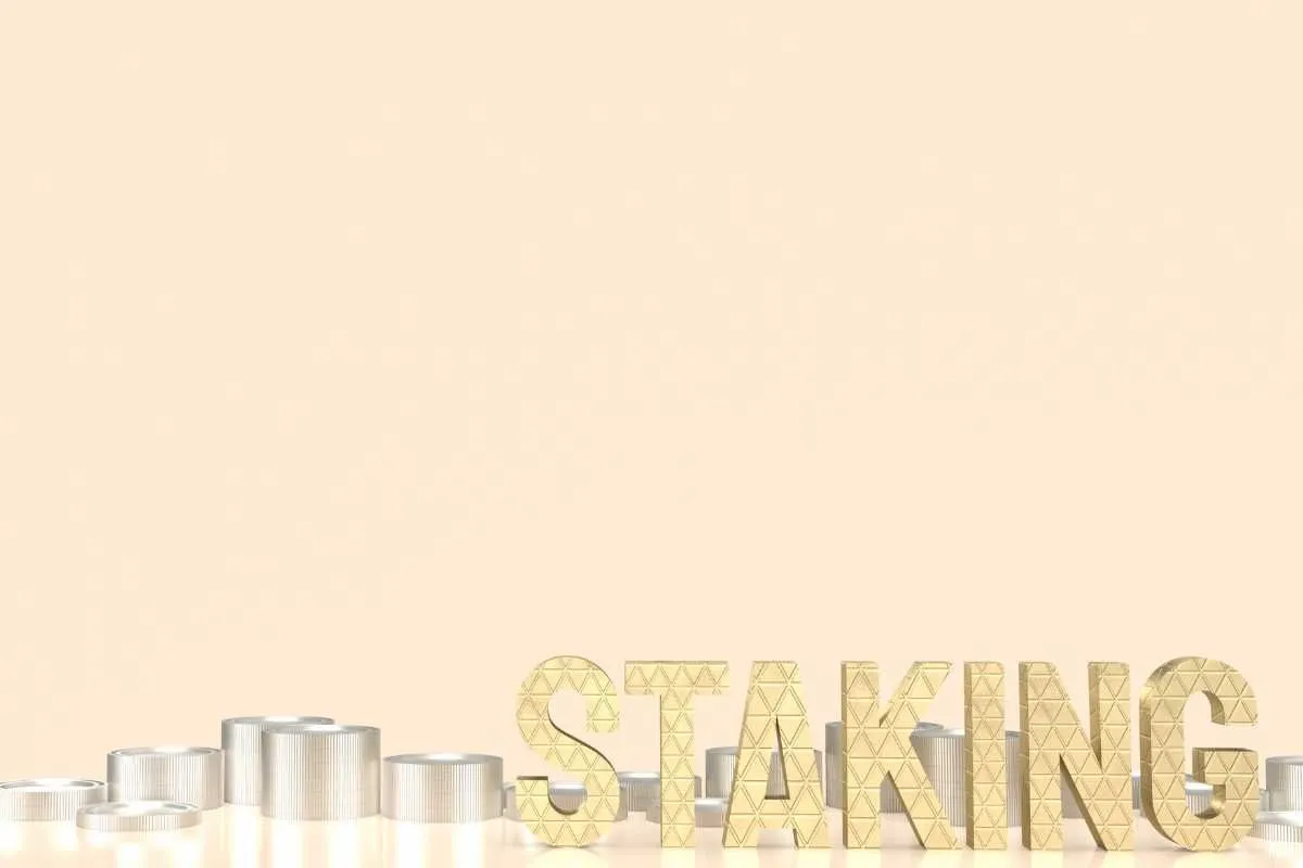 The word STAKING in large letters behind coin stacks