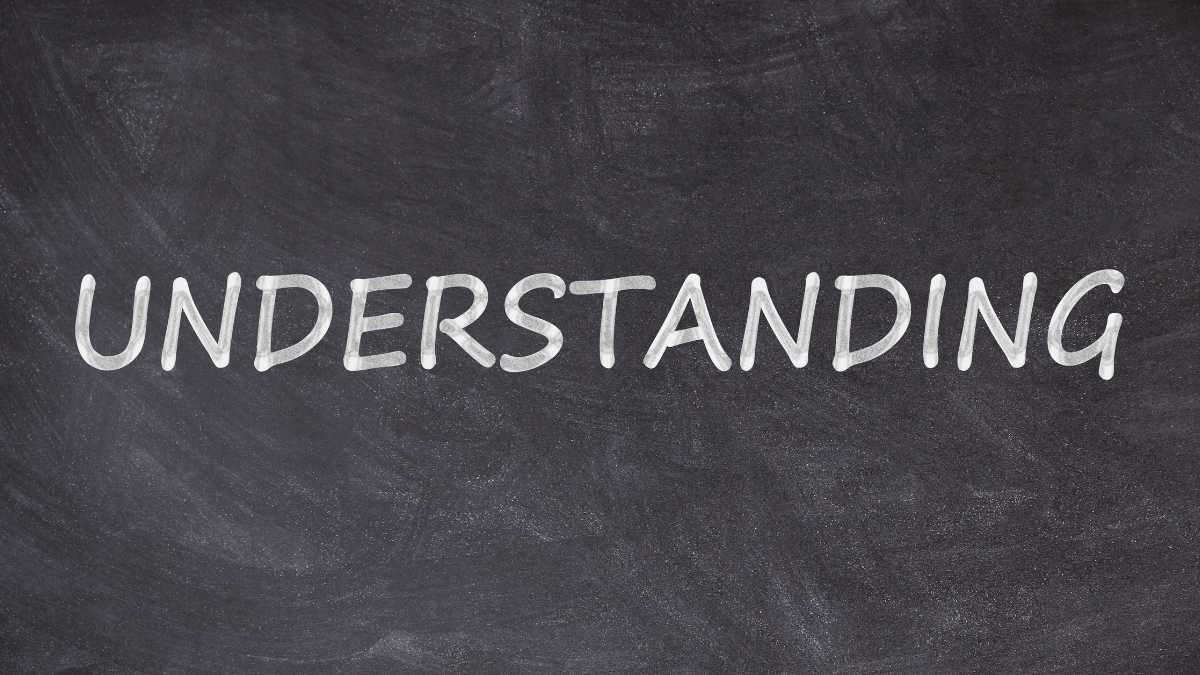 The word UNDERSTANDING is written in white on a blackboard