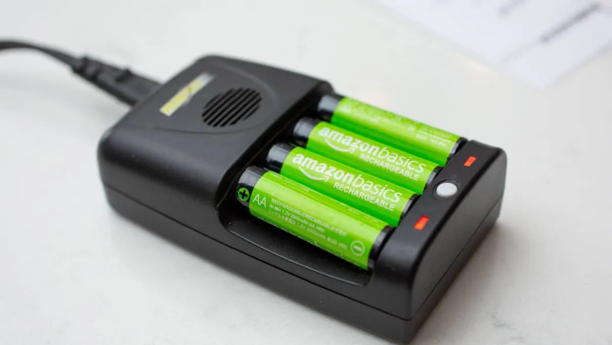 View of AmazonBasics rechargeable batteries charging in a charging unit