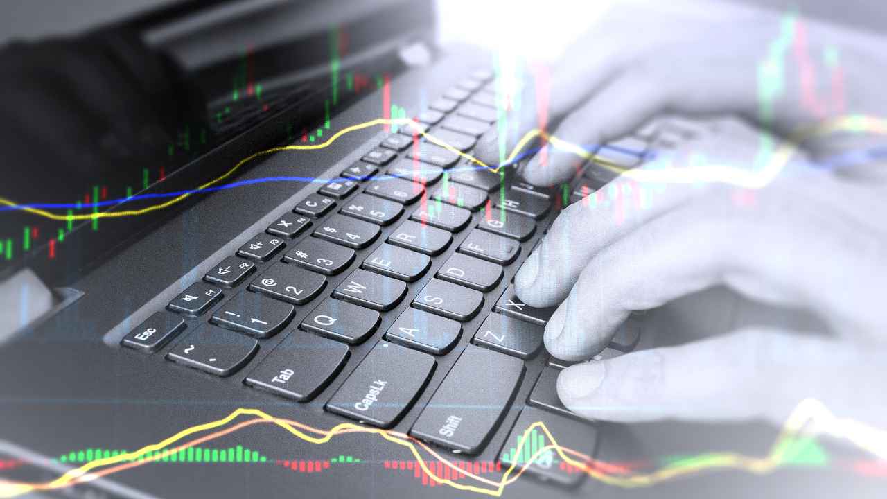 a close-up of hands typing on a keyboard