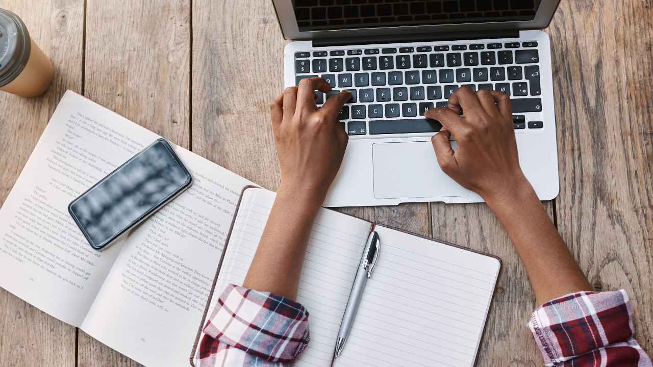 A person typing on a laptop