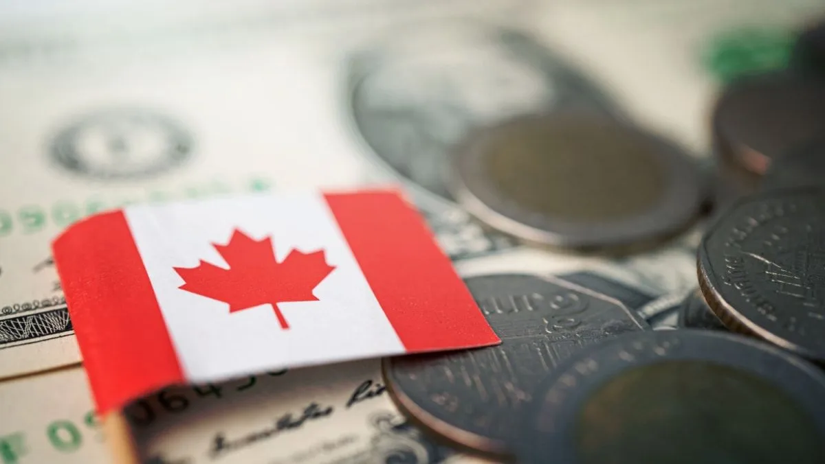 Loonie slides after Bank of Canada cuts rates