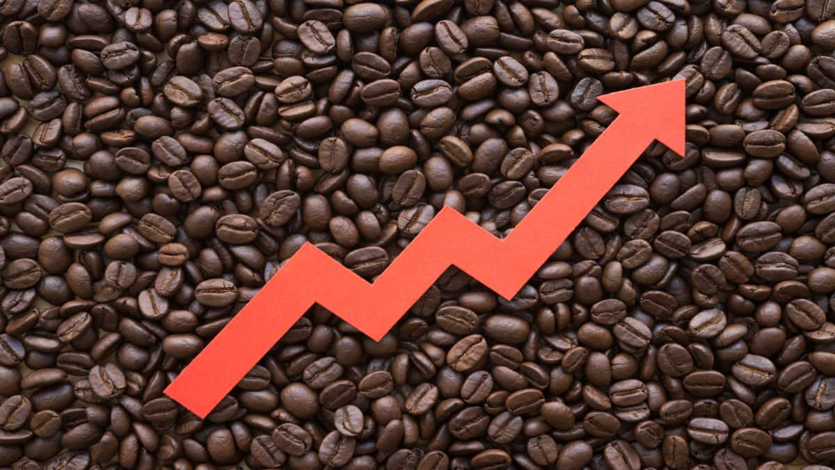 coffee beans and red upward arrow