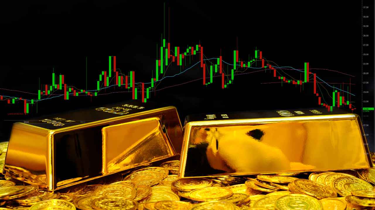 gold bars and coins with a graph in the background