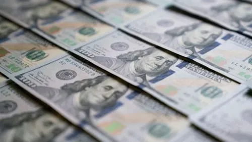 Dollar consolidates against peers as traders wait for key US inflation report