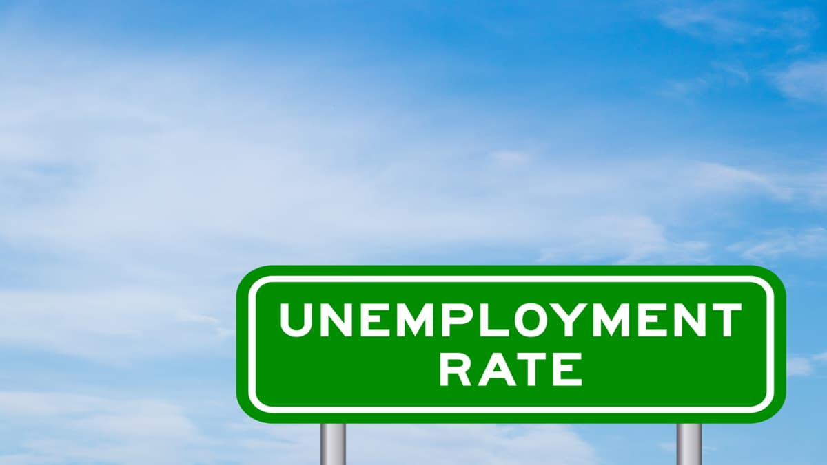 unemployment rate written on a sign